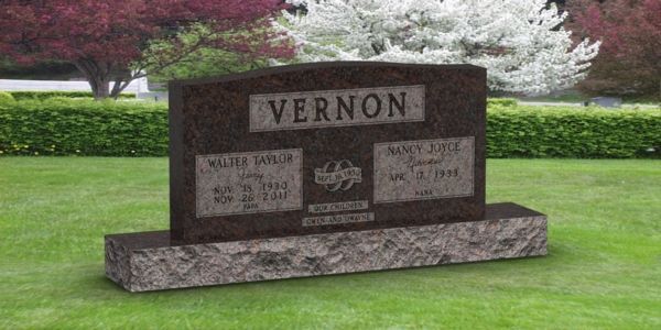 A gravestone in a cemetery with the name vernon on it