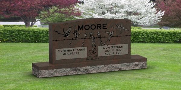 A gravestone in a cemetery with the name moore on it