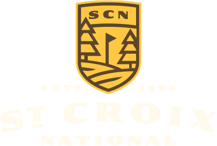 The logo for st. croix waterfall is a shield with a golf ball on it.