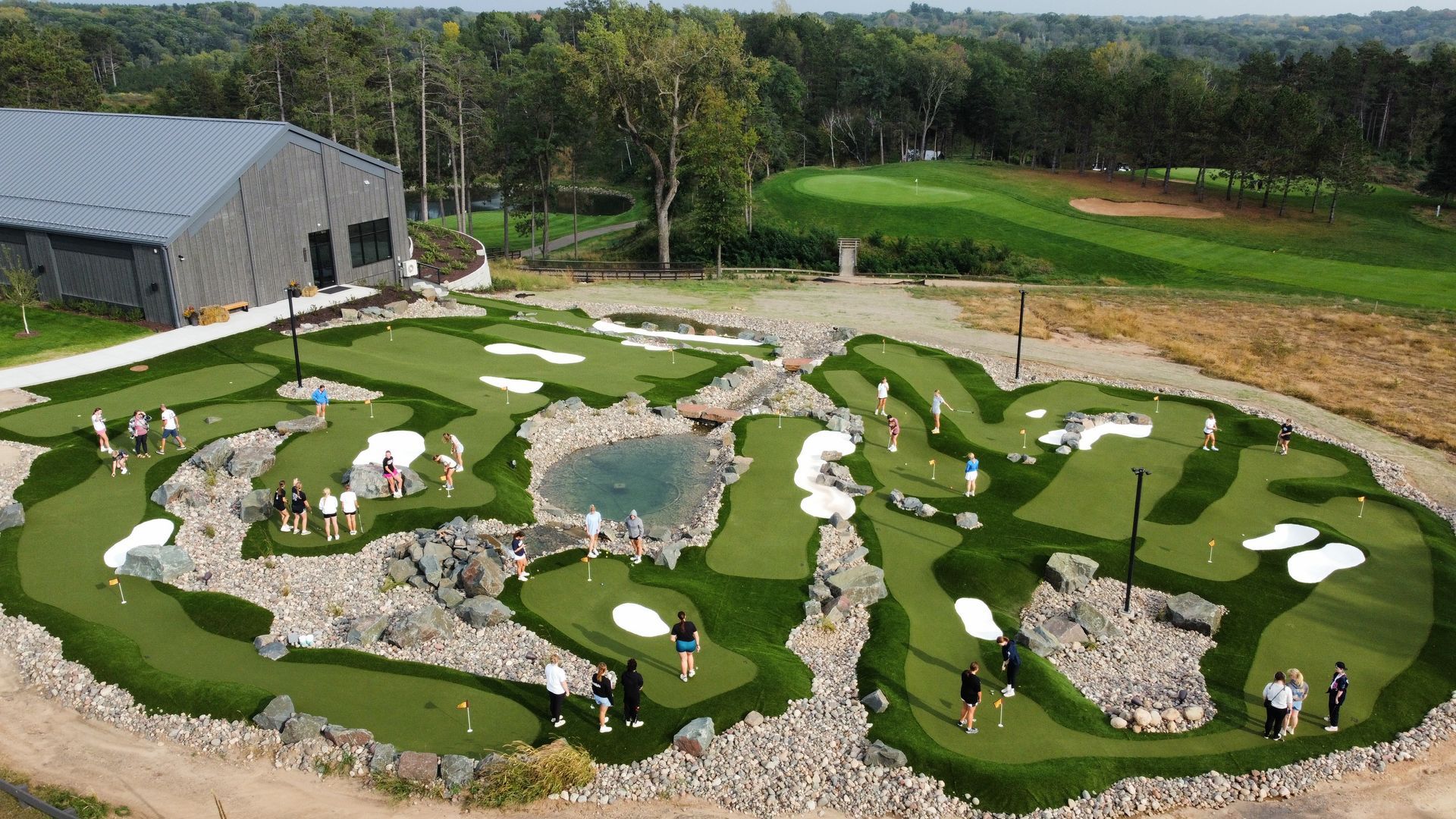 An aerial view of a mini golf course with people playing