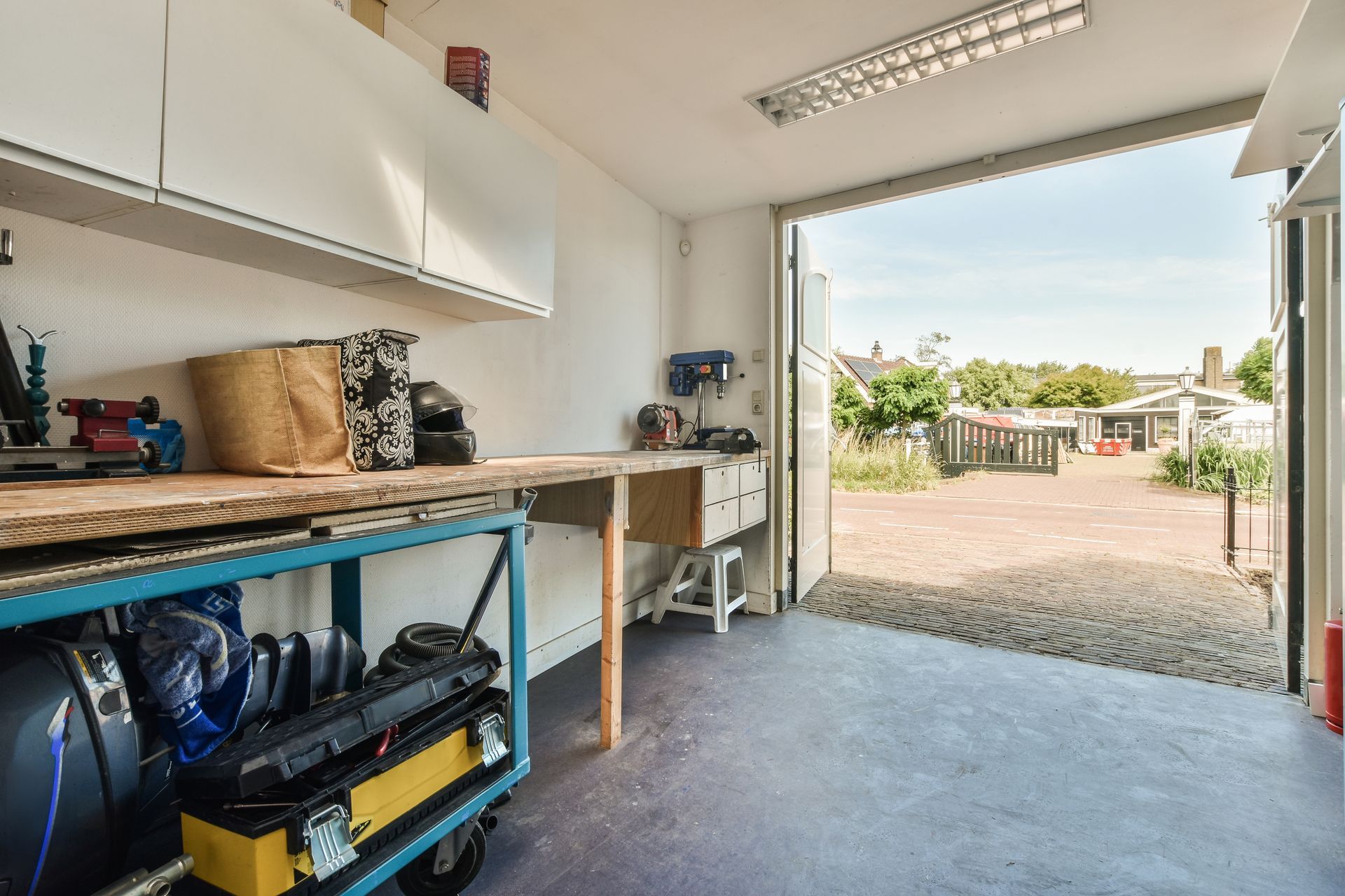 garage space with white cabinets