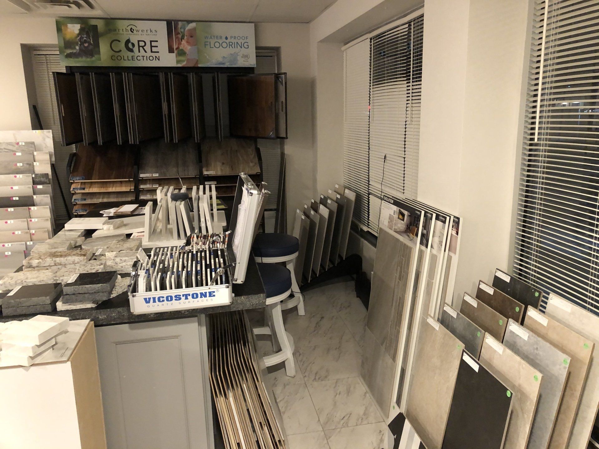 A showroom filled with lots of tiles and a sign that says core