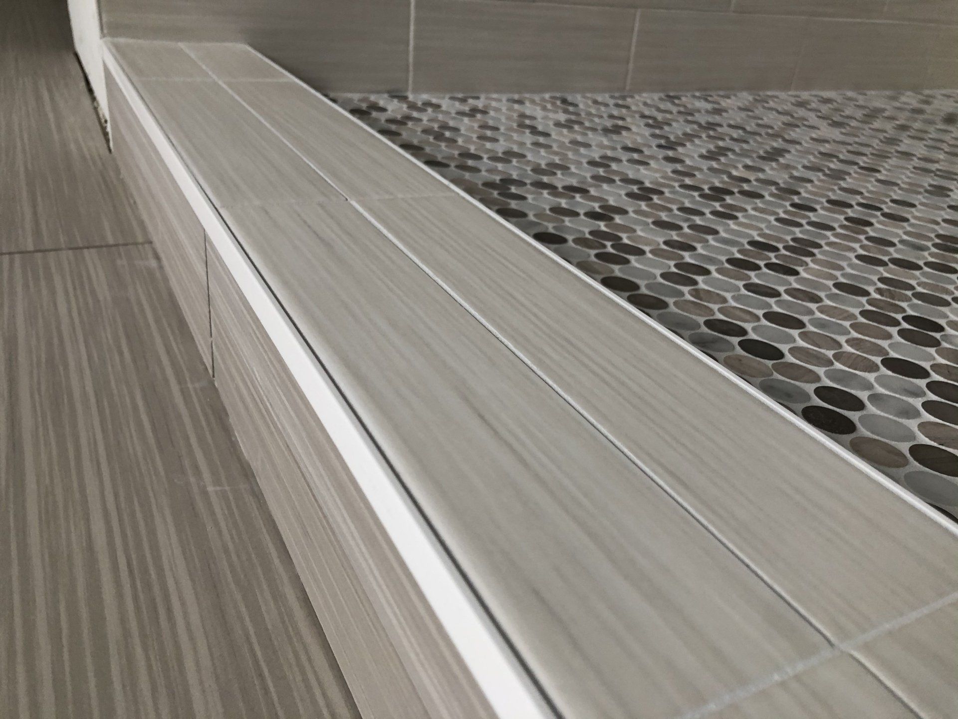 Custom shower with a tiled floor in Edina, MN