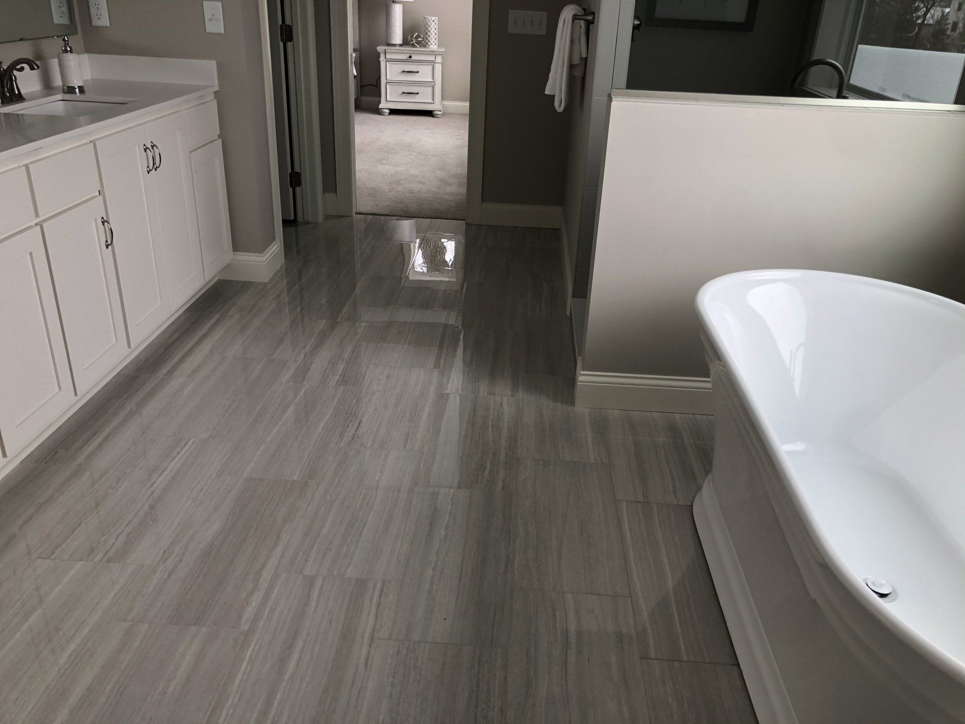 Custom tile work | bathtub in the middle of the bathroom.