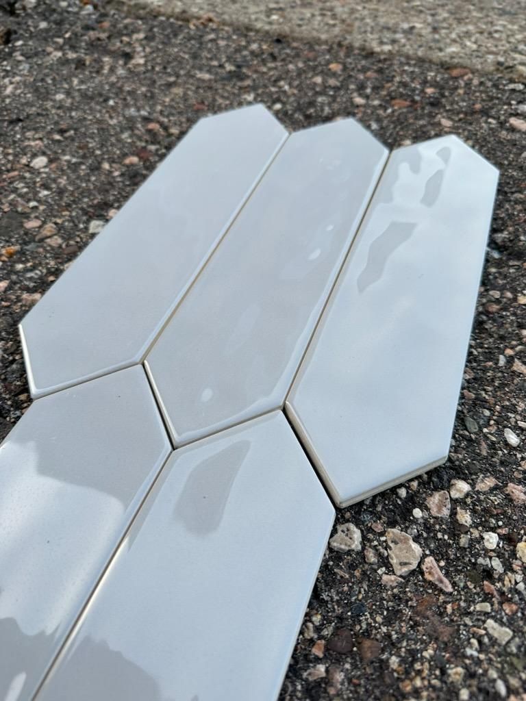 Special offer from BYN the Tile Crew | white tiles | A piece of white tile is laying on the ground.