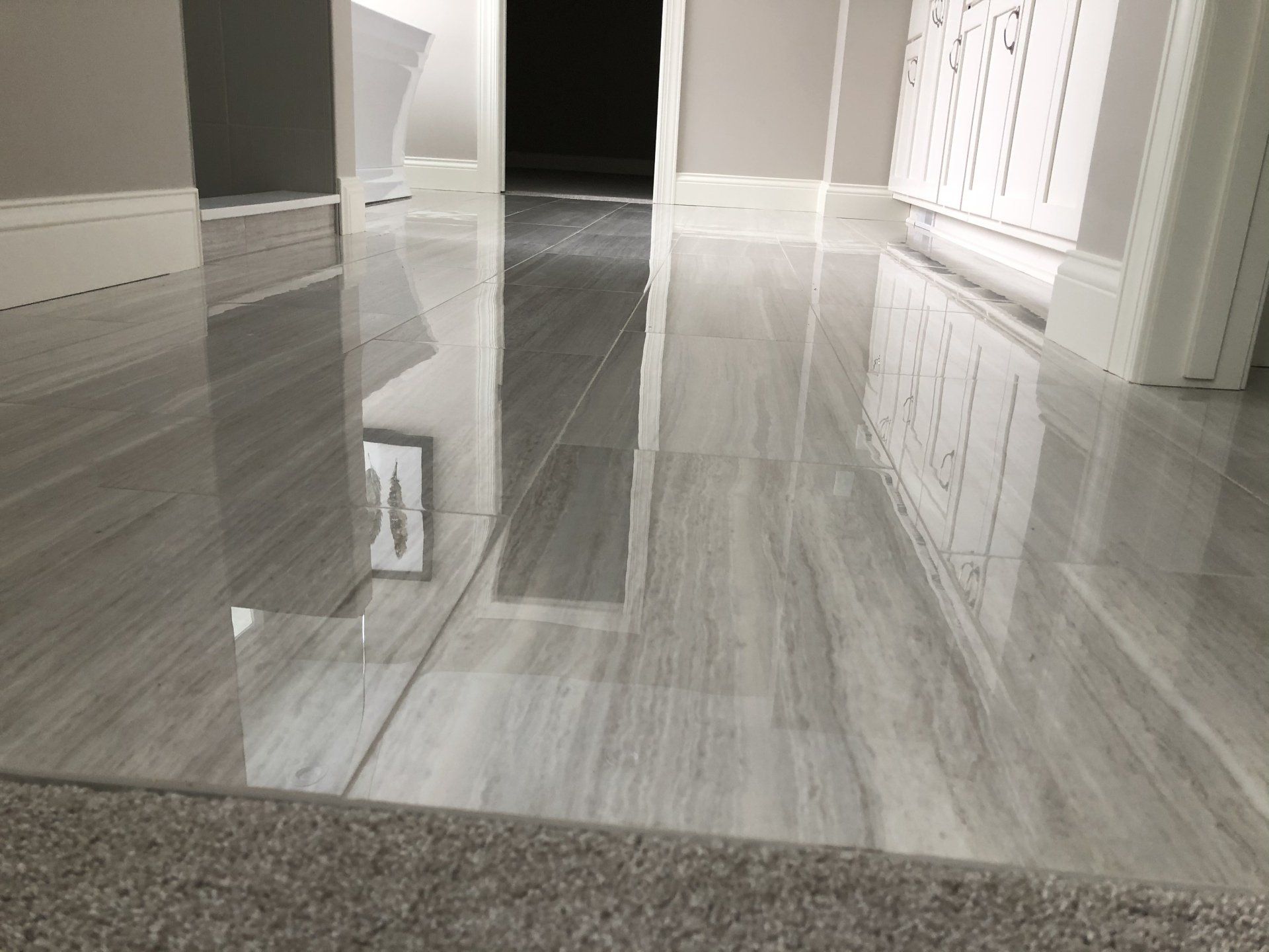 Marble floor and a reflection of a picture on it.