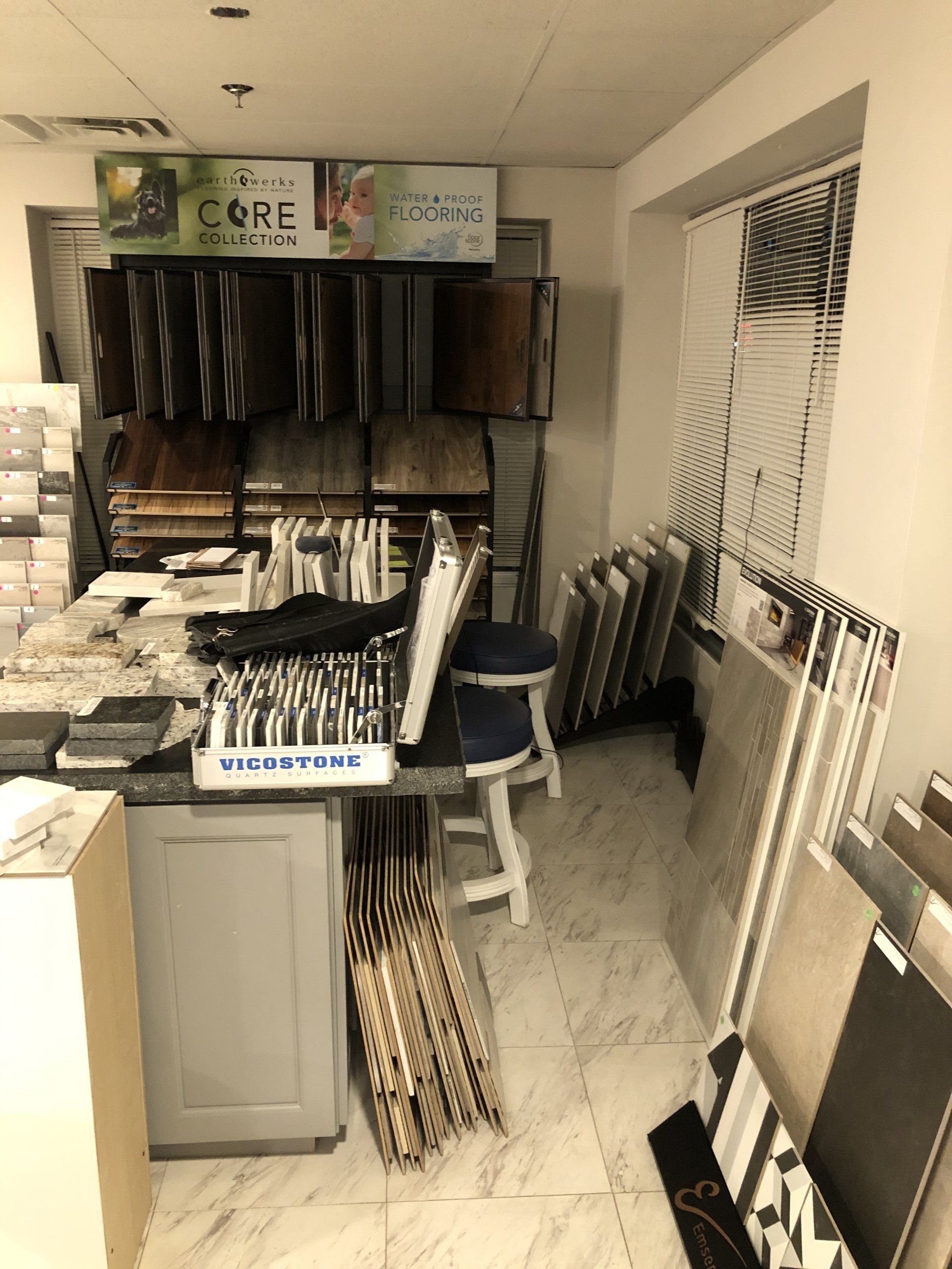 A showroom filled with lots of tiles and stools.