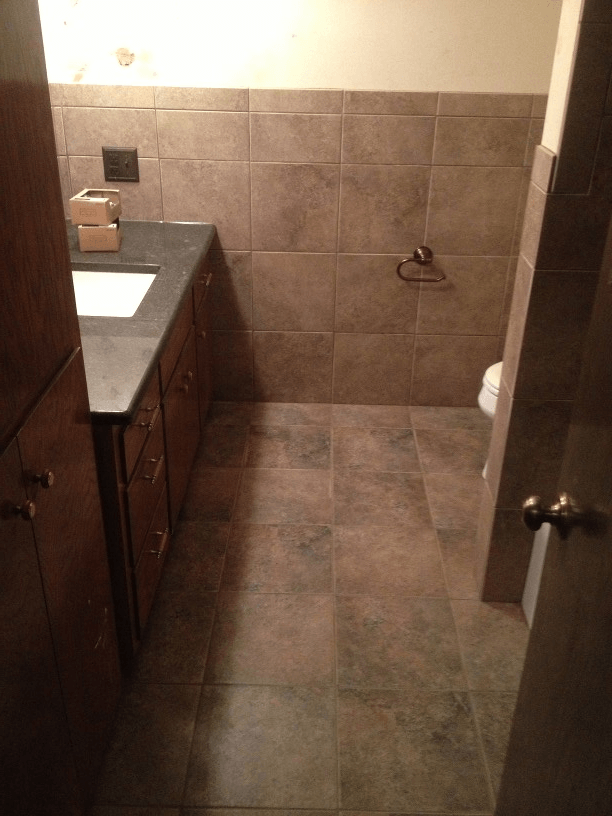 A tiled bathroom with a sink