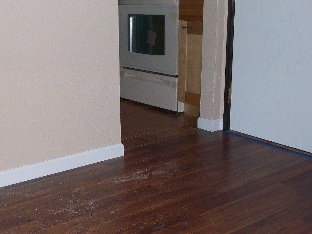 Hardwood floors and a white stove