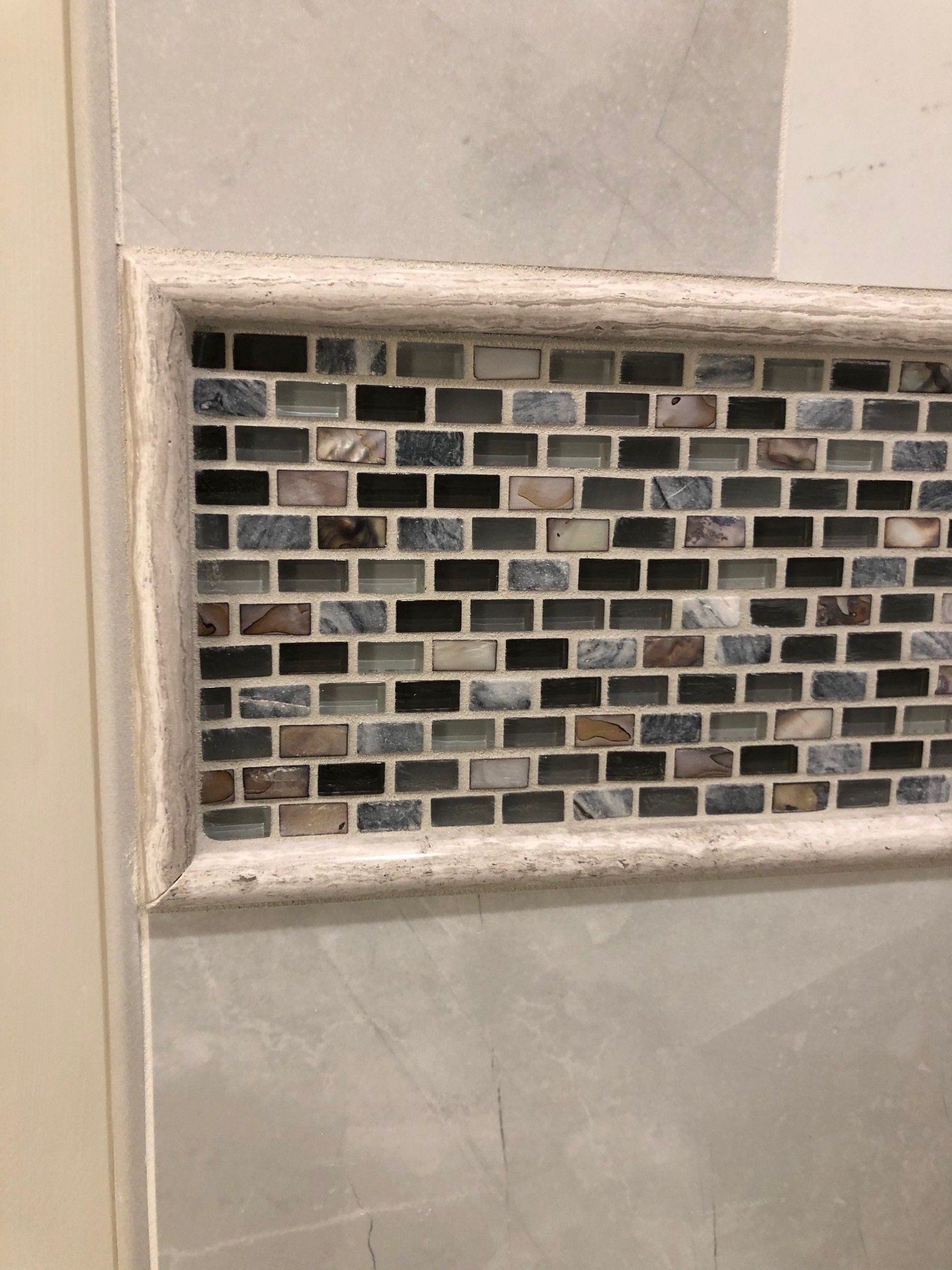 A close up of a tiled wall in a bathroom in St.Paul.