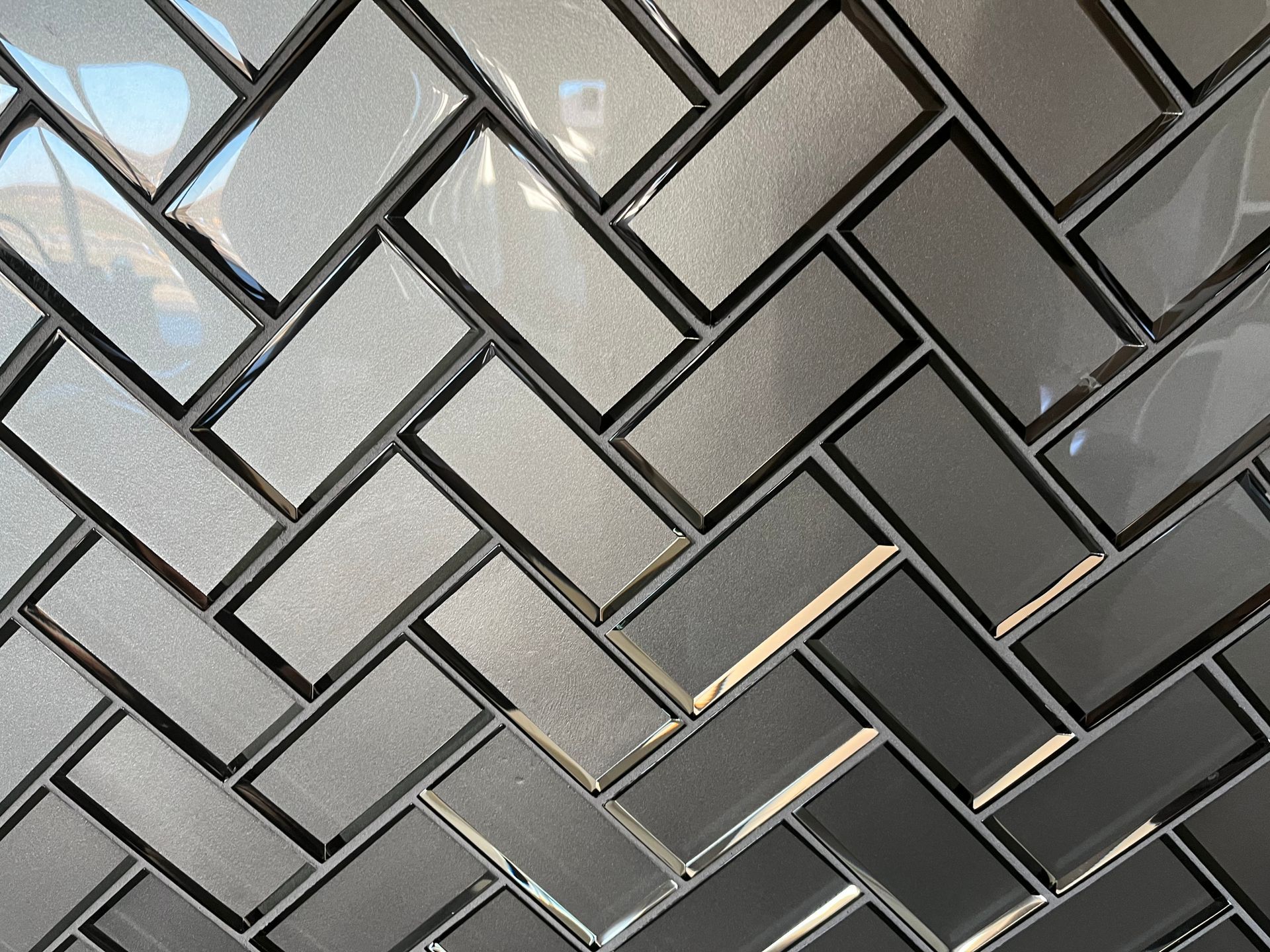 Kitchen backsplash  with herringbone tile pattern.