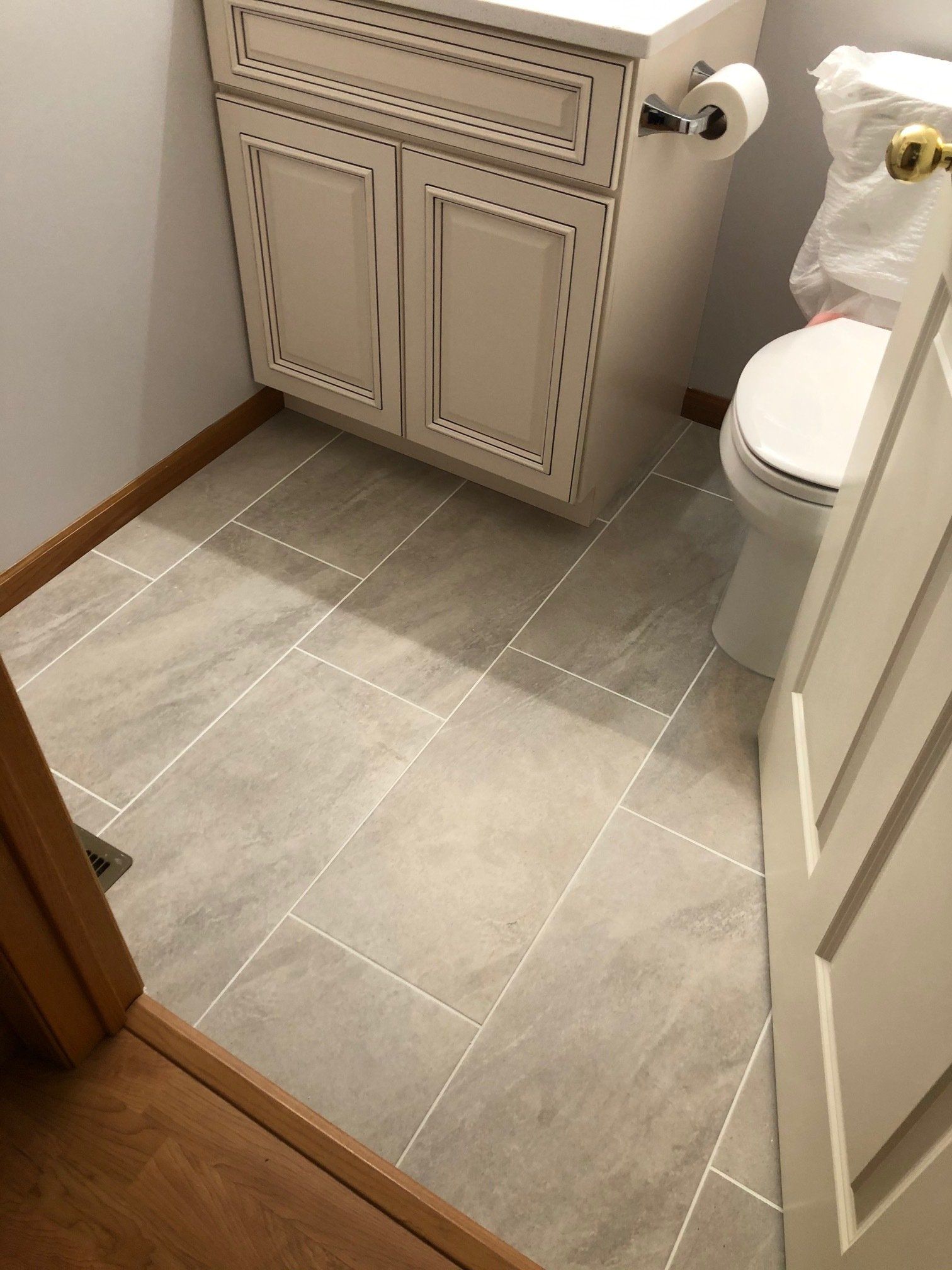 Small bathroom renovations | A bathroom with a toilet , sink , and tile floor.