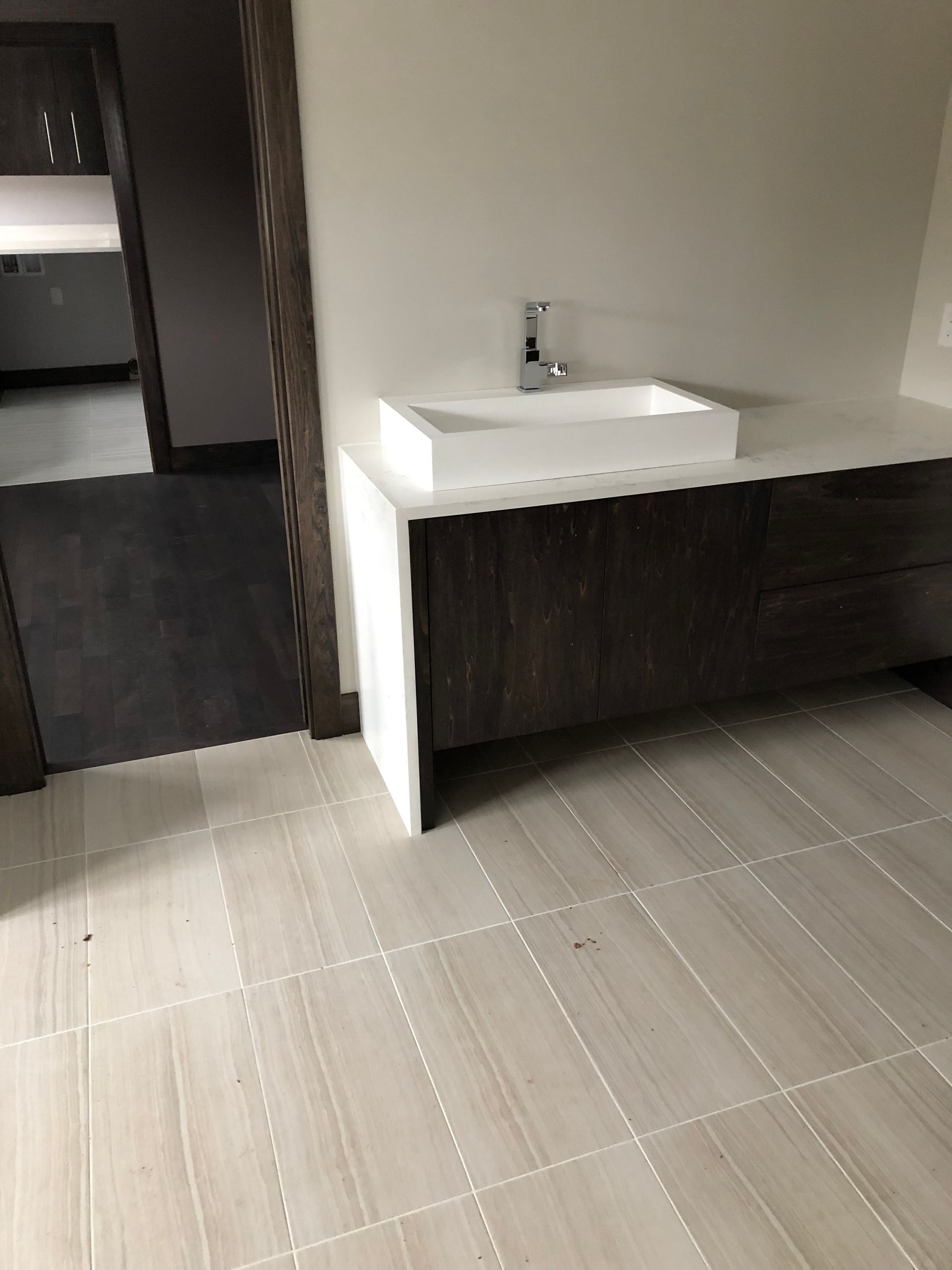 A bathroom redo idea with a sink and a tiled floor