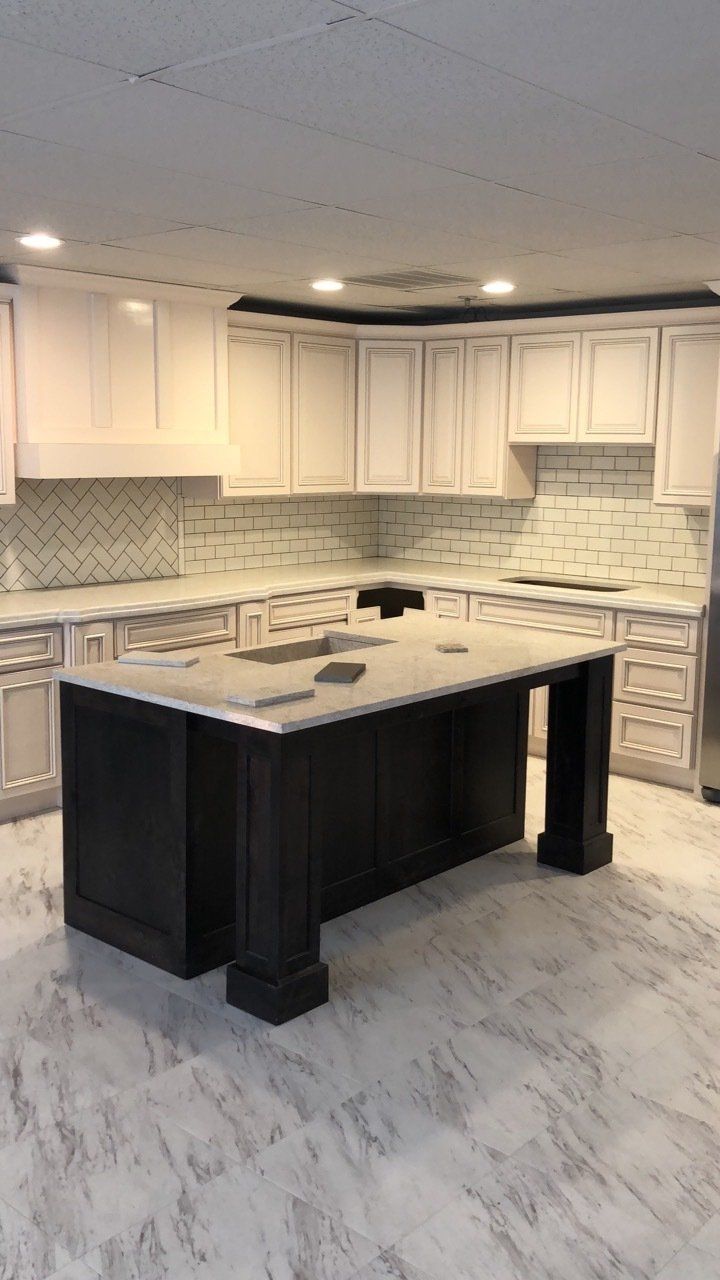 Kitchen renovation project | There is a large island in the middle of the kitchen.