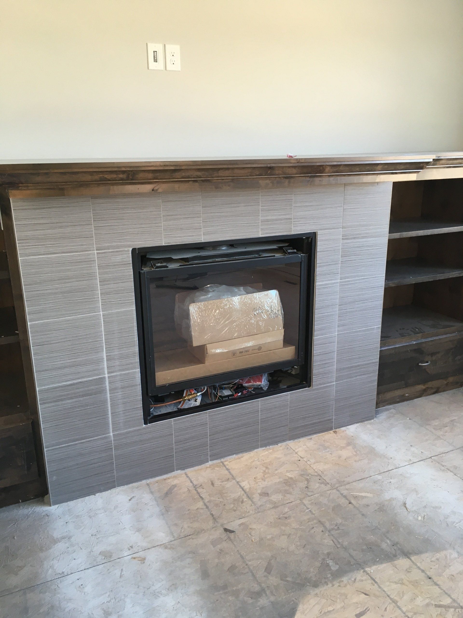 There is a fireplace in the middle of the room.