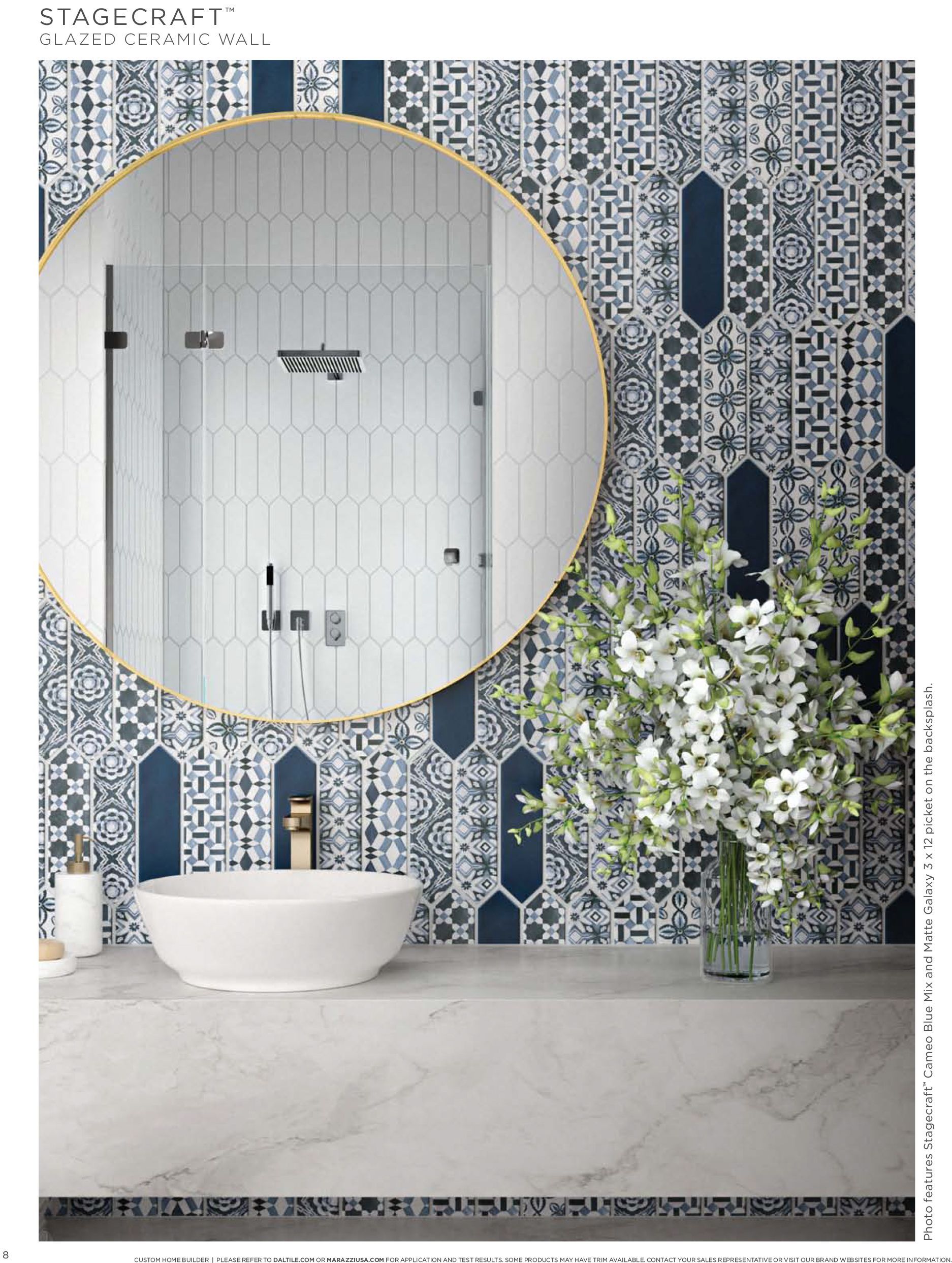 Bathroom remodel photo | A bathroom with a sink , mirror , and blue and white tiles.