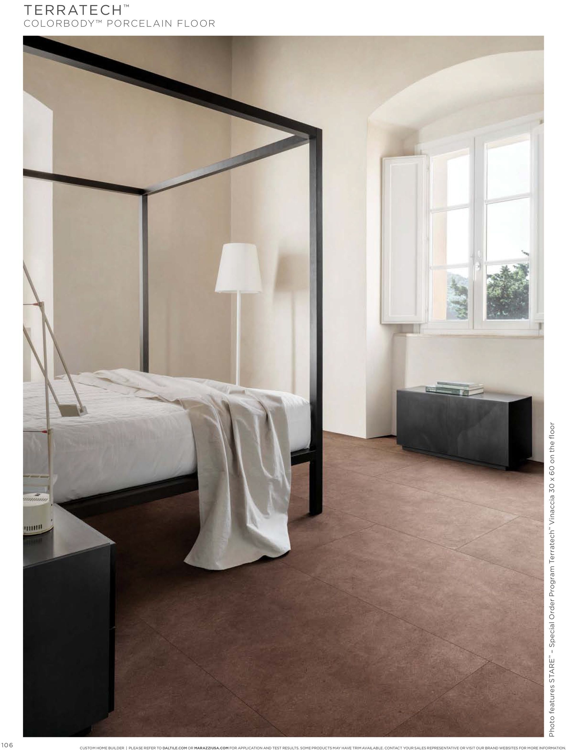 A bedroom with a four poster bed and a window.