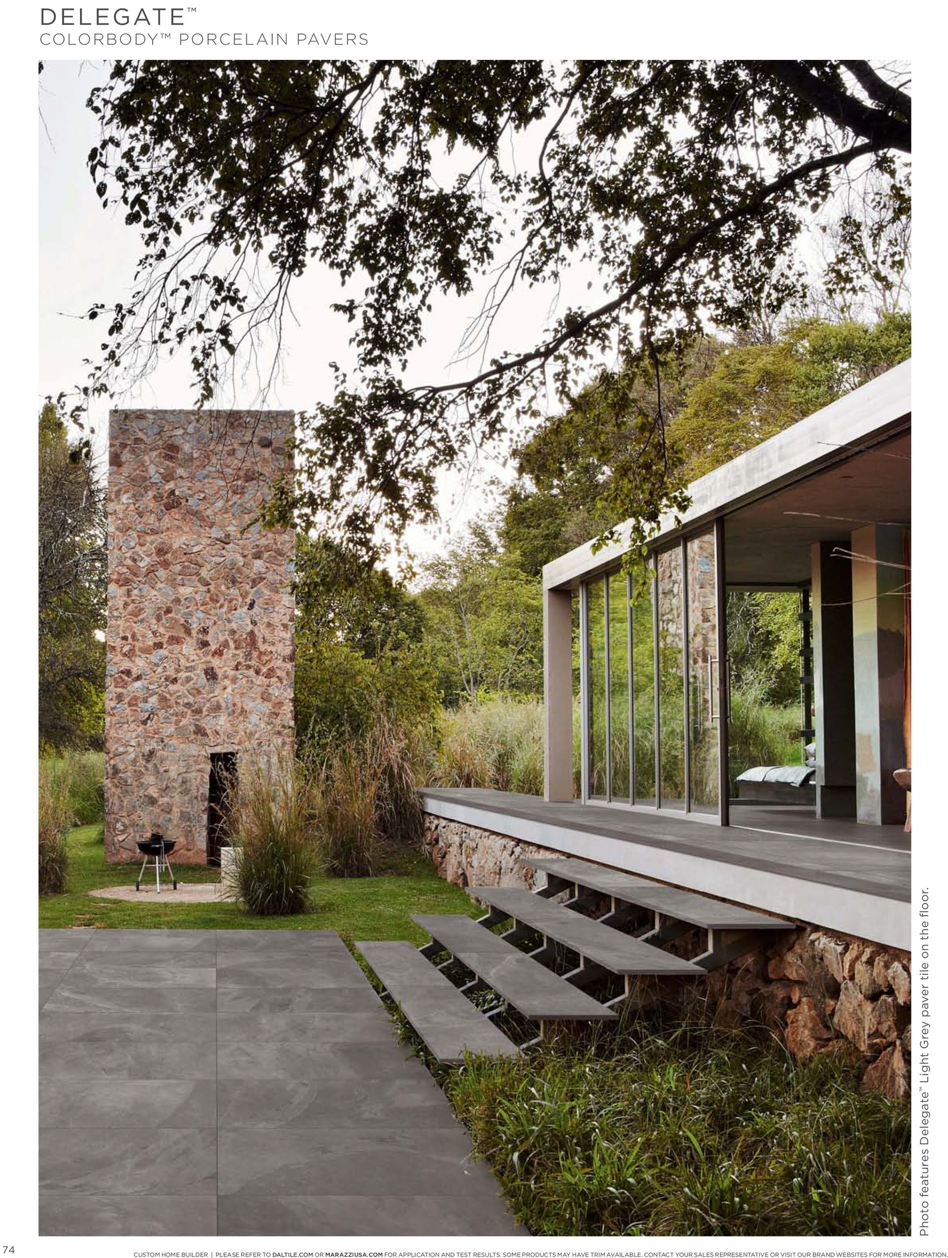A picture of a modern house with stairs leading up to it.