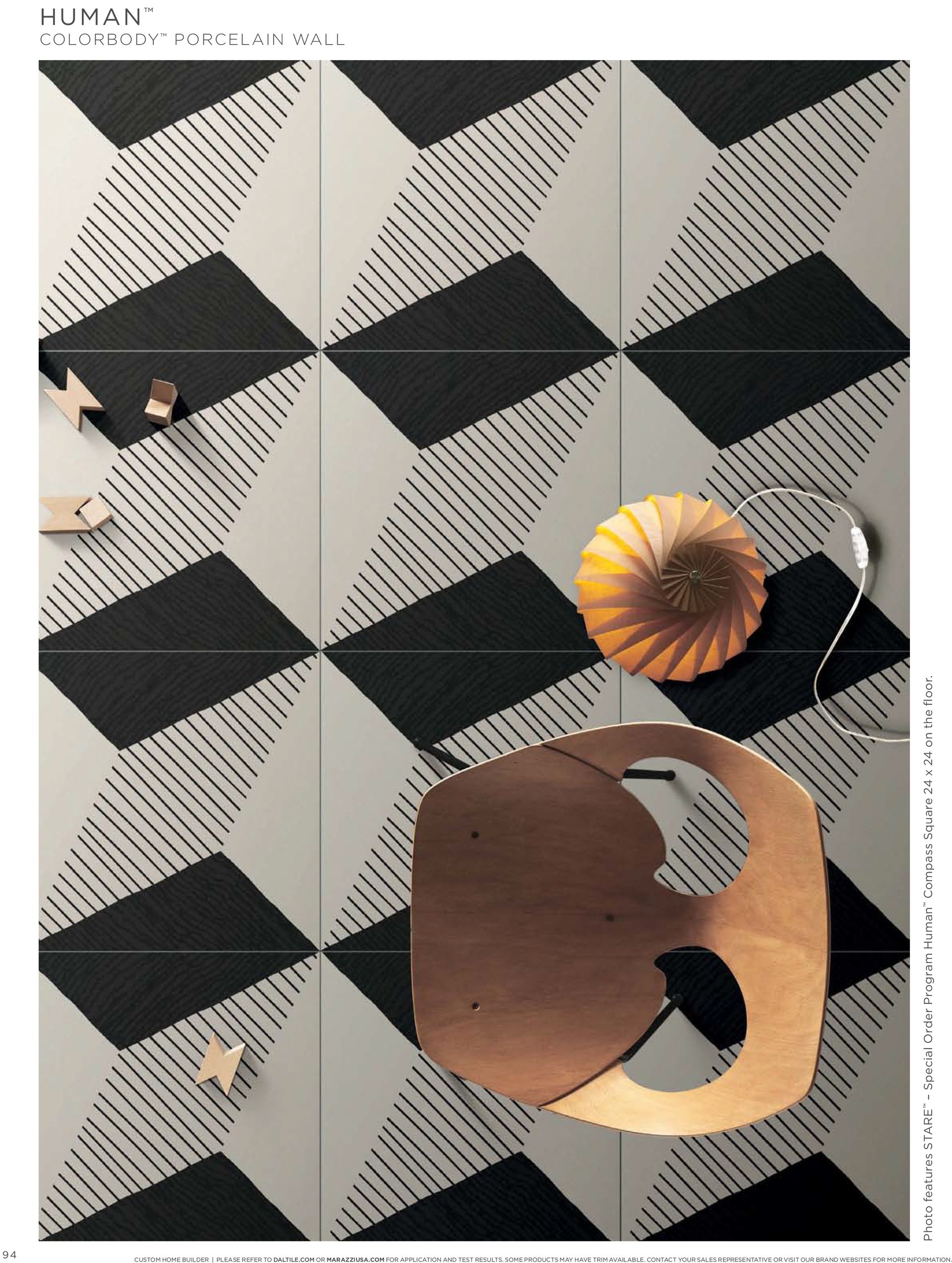 A black and white checkered floor with a chair on it