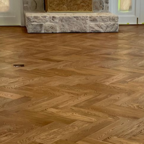 Person Applying Sealant to a Wooden Floor With a Paint Roller — CM Timber Flooring in East Ballina, NSW