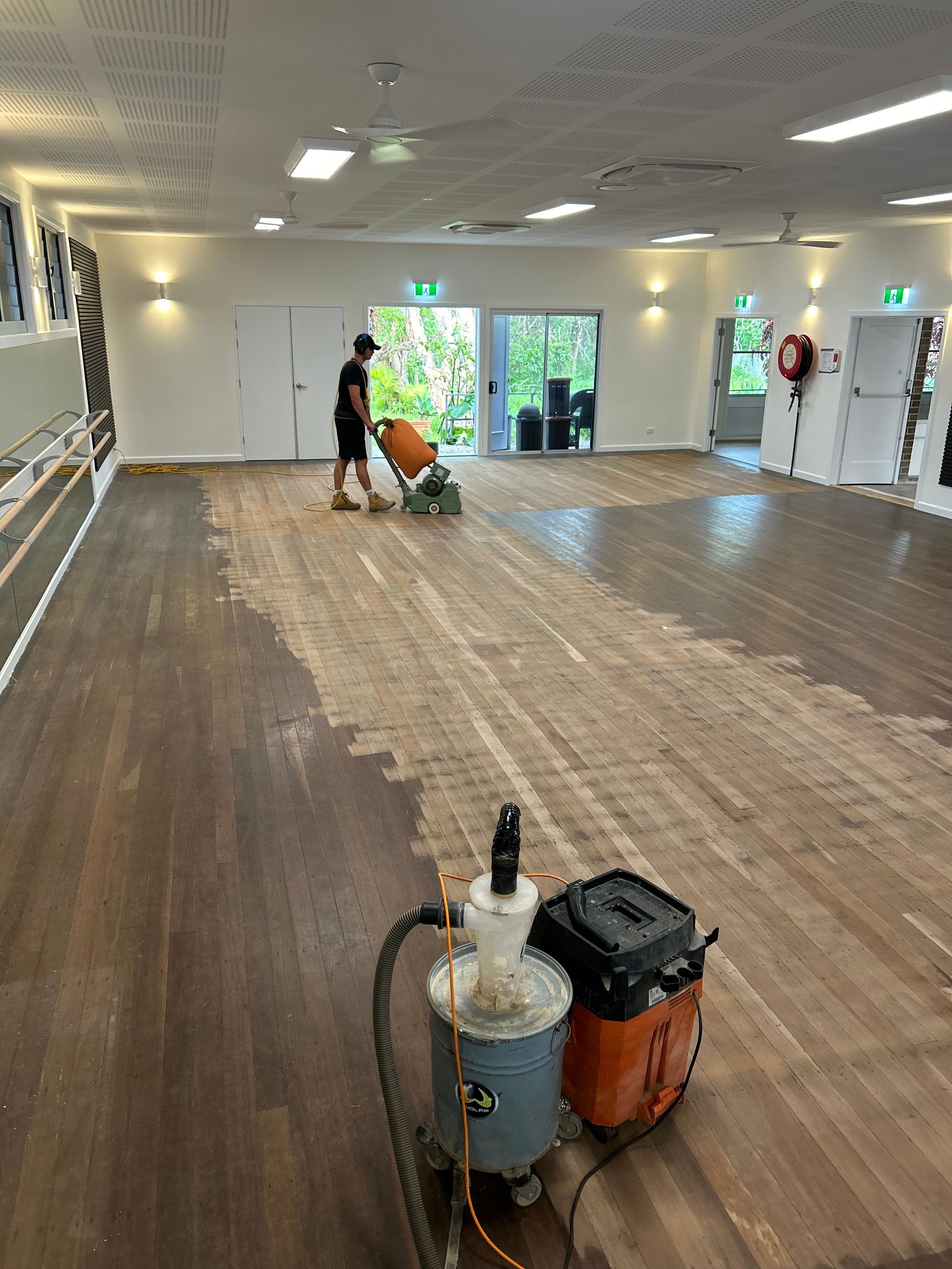 Floor Sander in Use on a Wooden Parquet Floor, Creating Sawdust — CM Timber Flooring in Tweed Heads, NSW