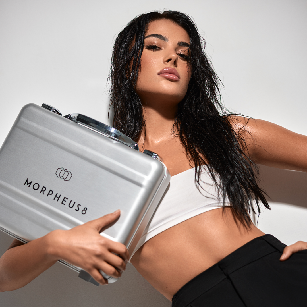 Eva Navarro is holding a briefcase that says morpheus8 on it