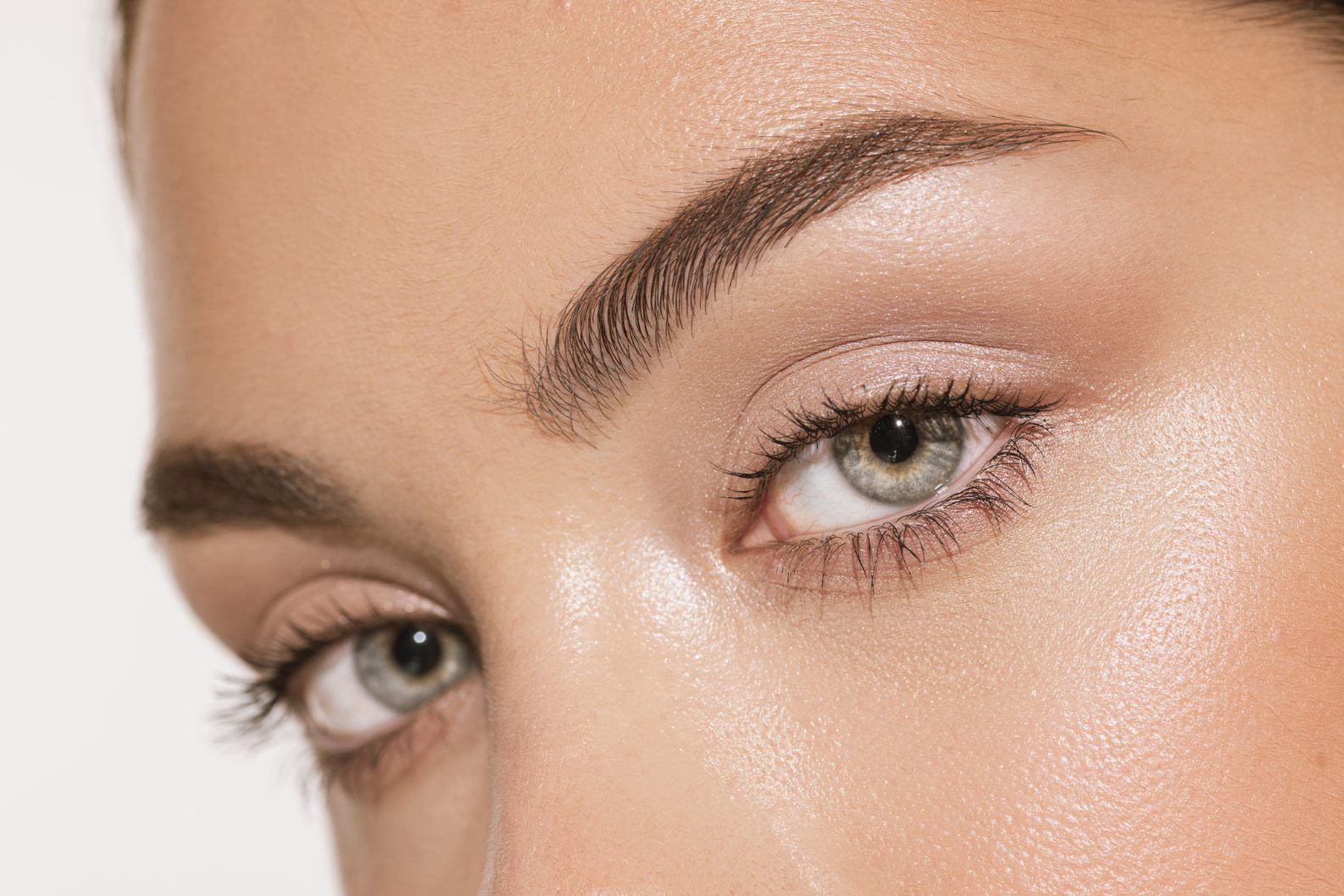 A close up of a woman 's eye with makeup on.