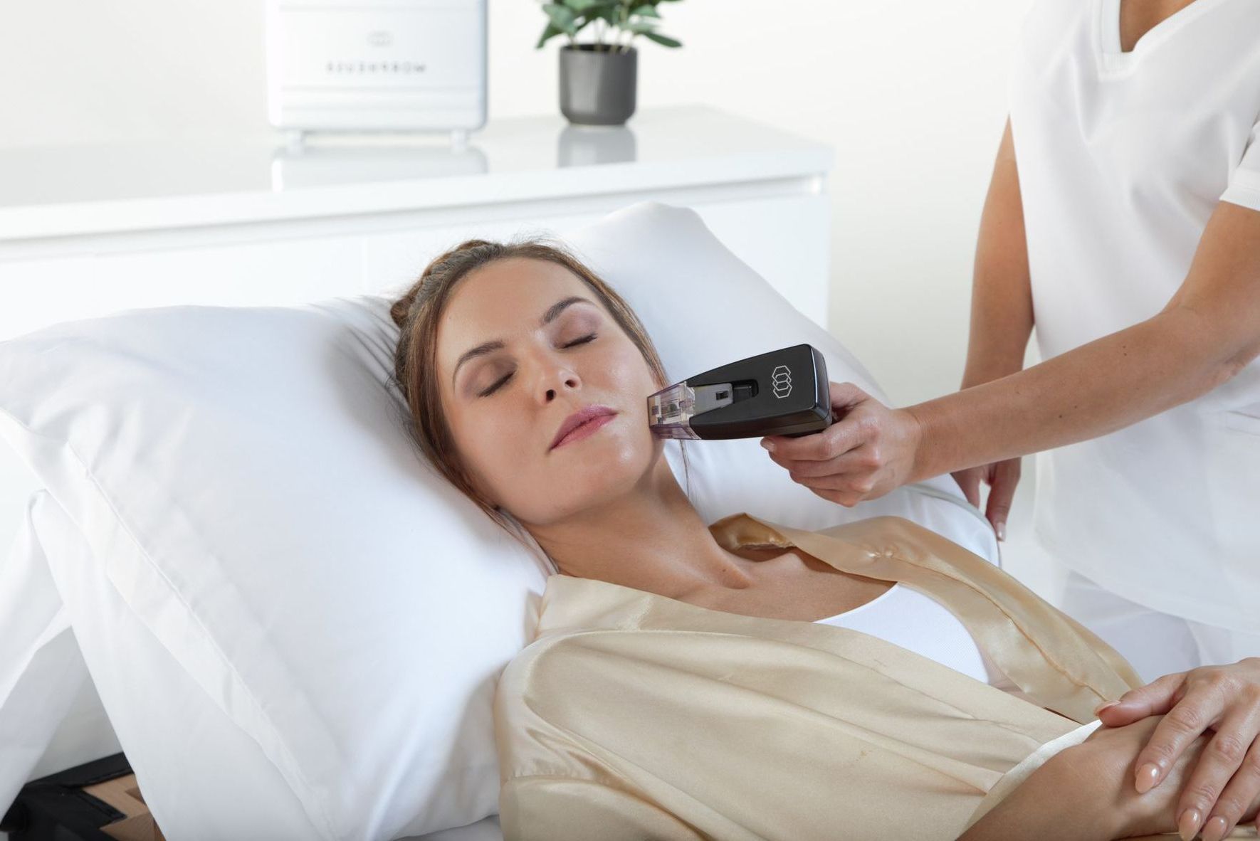 a woman is getting Morpheus8 treatment applied to her lower face