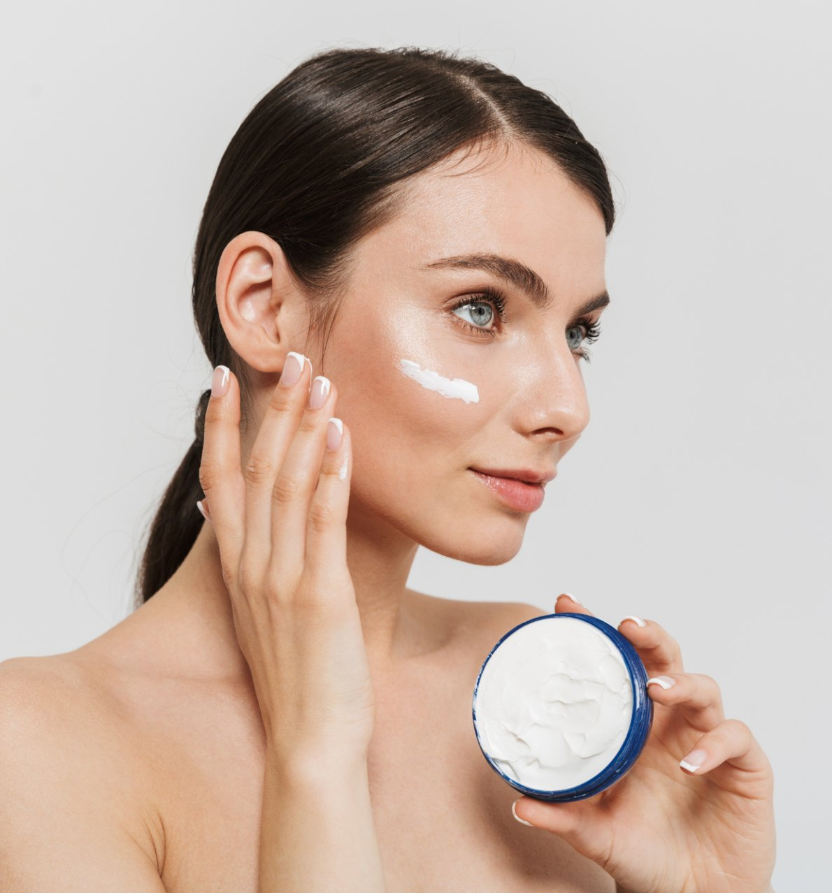woman applying medical-grade skincare cream