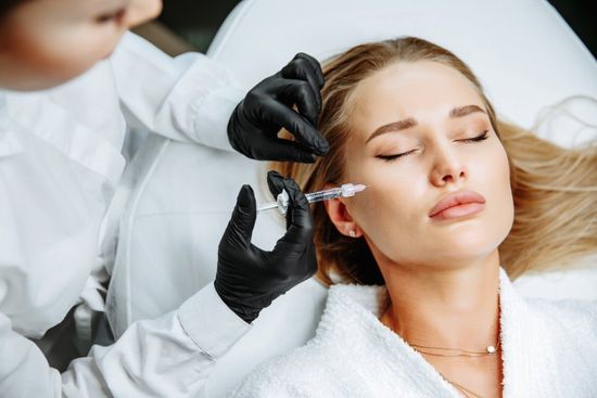 woman receiving dermal filler injection