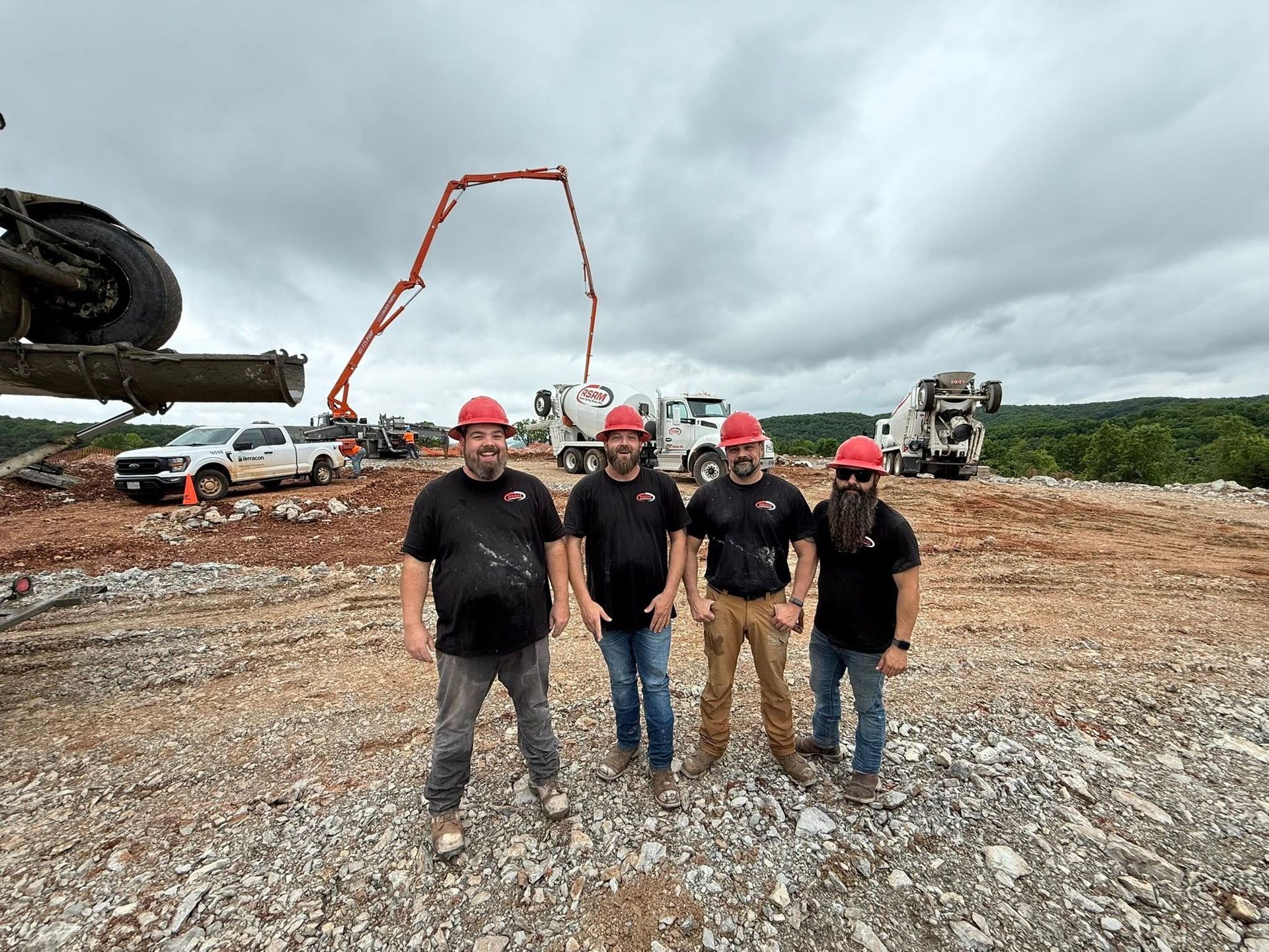 Concrete workers in front of a cement truck