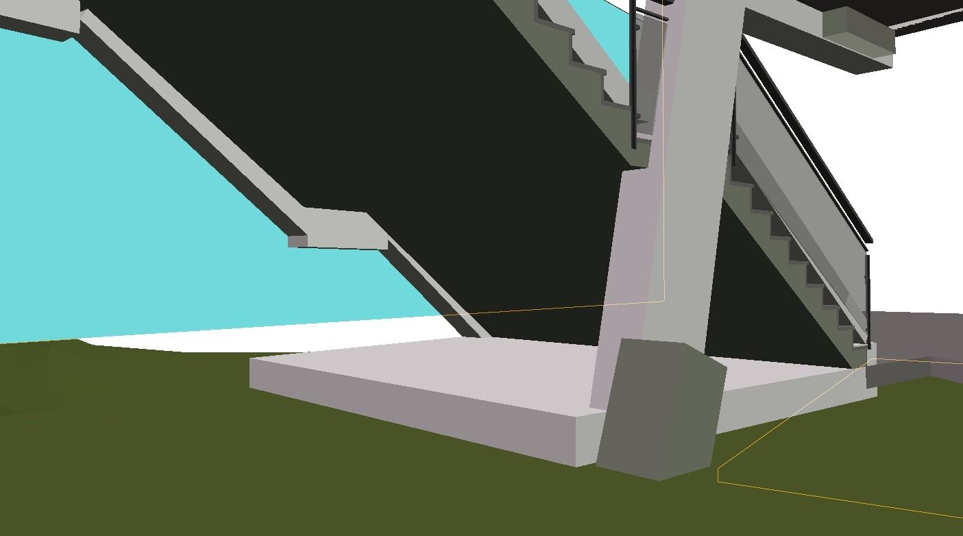 Vista dal basso di un ponte di cemento grigio con la parte inferiore nera e il cielo azzurro sullo sfondo, posto su un terreno verde.