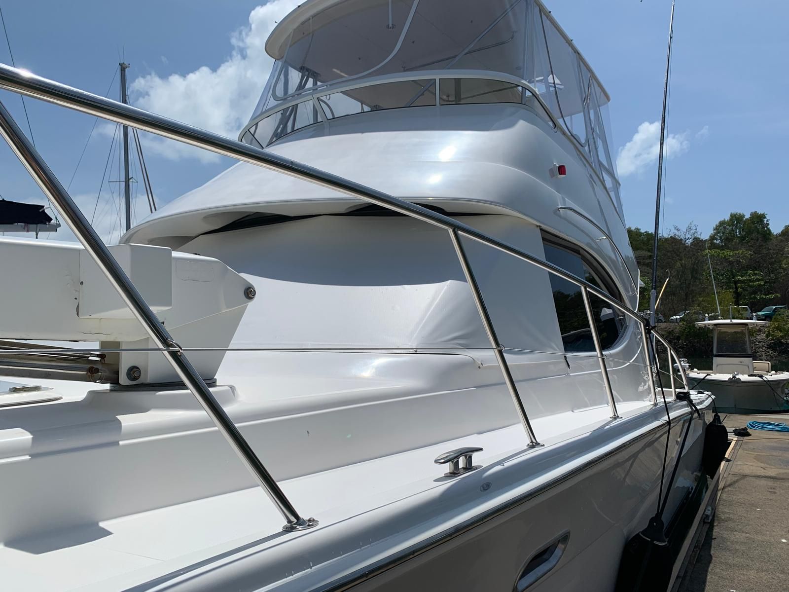 Mechanic Working on Boat Motor in a Shop; Wearing Gloves — Ocean Mate Marine Services in Brisbane, QLD