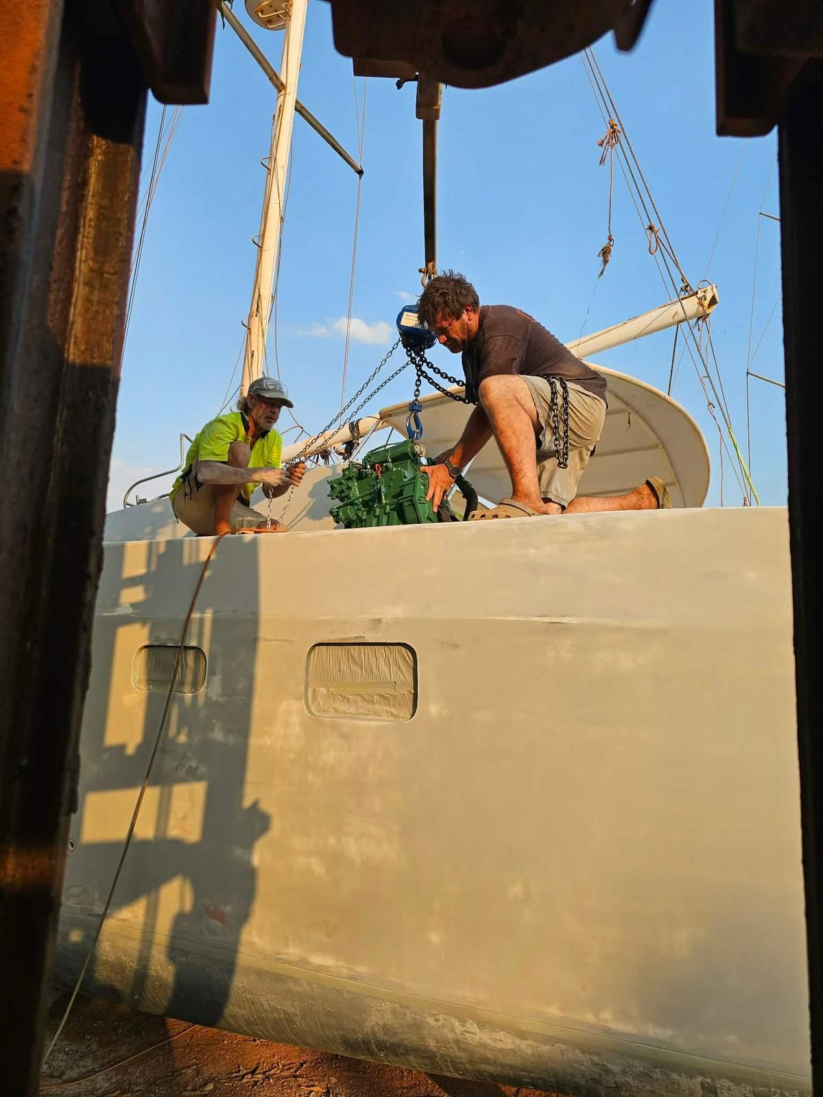 Man Working on a Boat Engine, Bending Over — Ocean Mate Marine Services in Brisbane, QLD