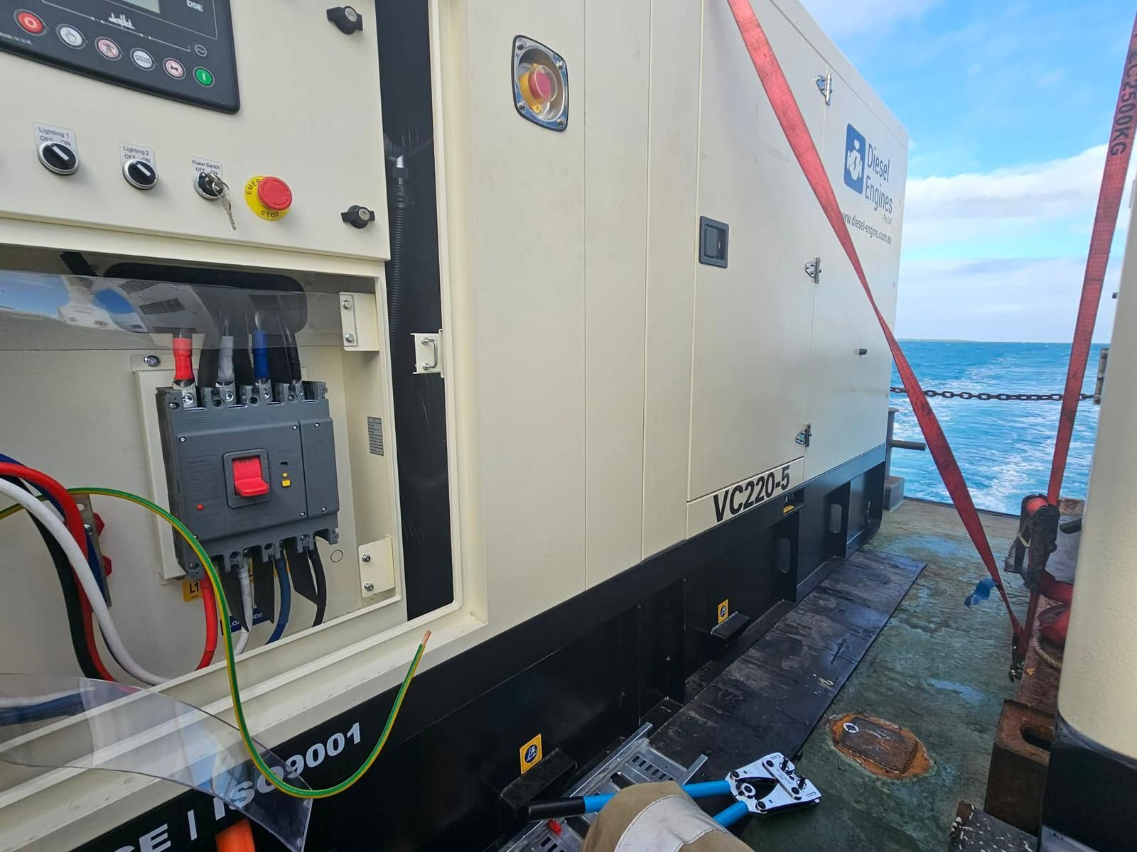 Man Working on Electrical Panel With a Laptop, Indoors — Ocean Mate Marine Services in Brisbane, QLD