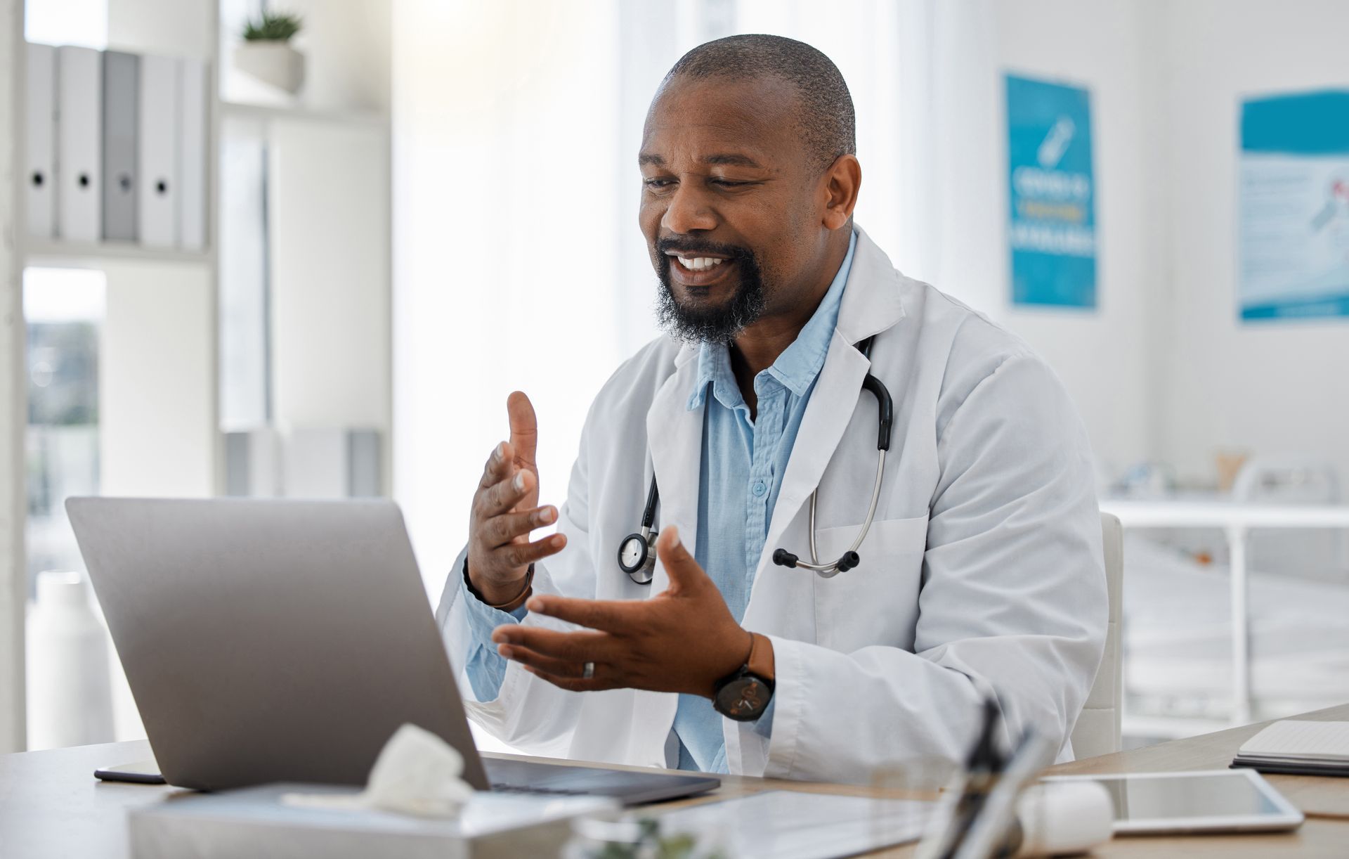 A doctor is examining a man 's throat with an otoscope.