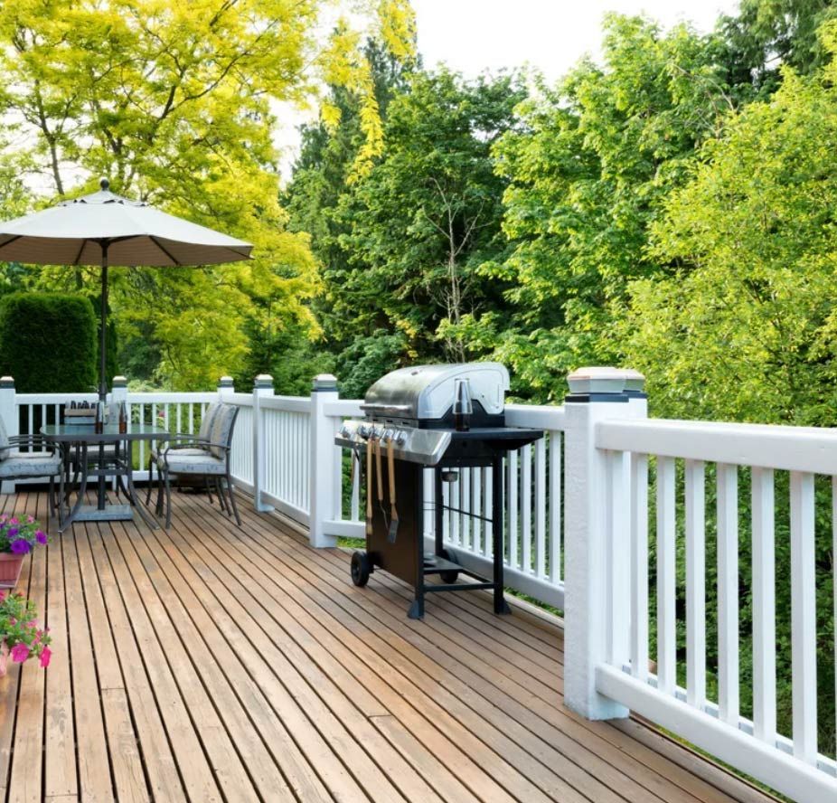 Clean Wooden Deck with Barbecue — Saving Time In Newcastle NSW