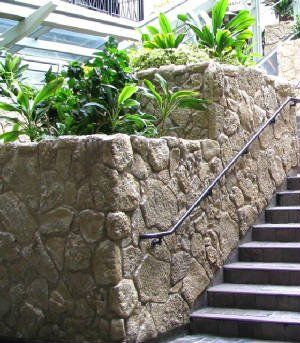 View of a stone wall constructed along the stairs