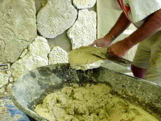 Contractor installing stone onto the wall