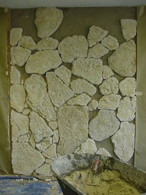 installation of  stone onto the wall in progress