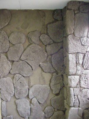 view of a wall with installed stone