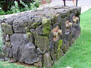View of an exterior constructed moss stone wall