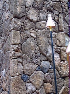 Closeup of a stone wall pillar
