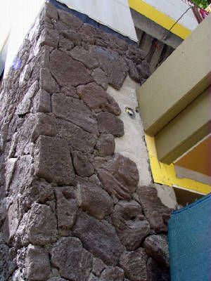Stone being installed onto the exterior wall