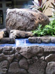 water feature with stone wall
