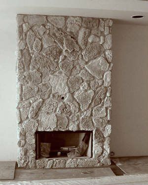 View of coral veneer stone wall near the fireplace