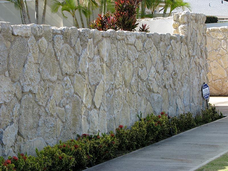 View of coral veneer stone boundary wall