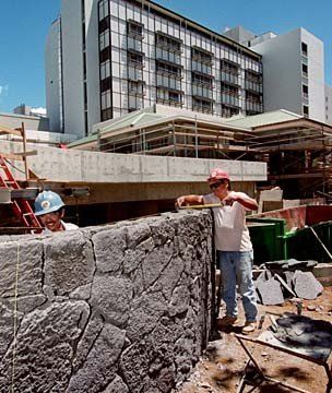 Lava veneer stone wall under construction
