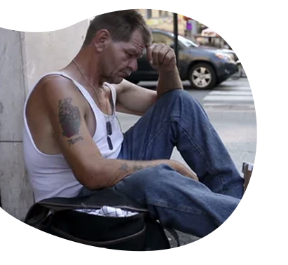 A young man in a black shirt is talking on a cell phone