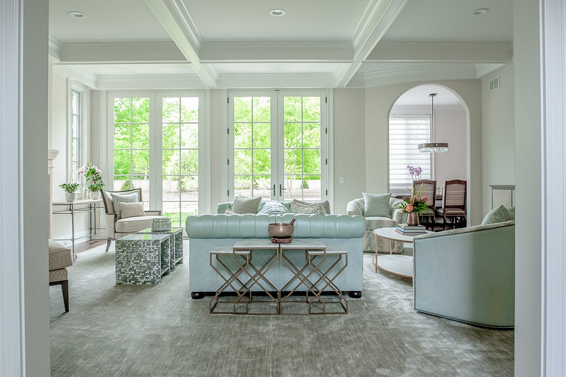 A living room filled with furniture and a lot of windows.